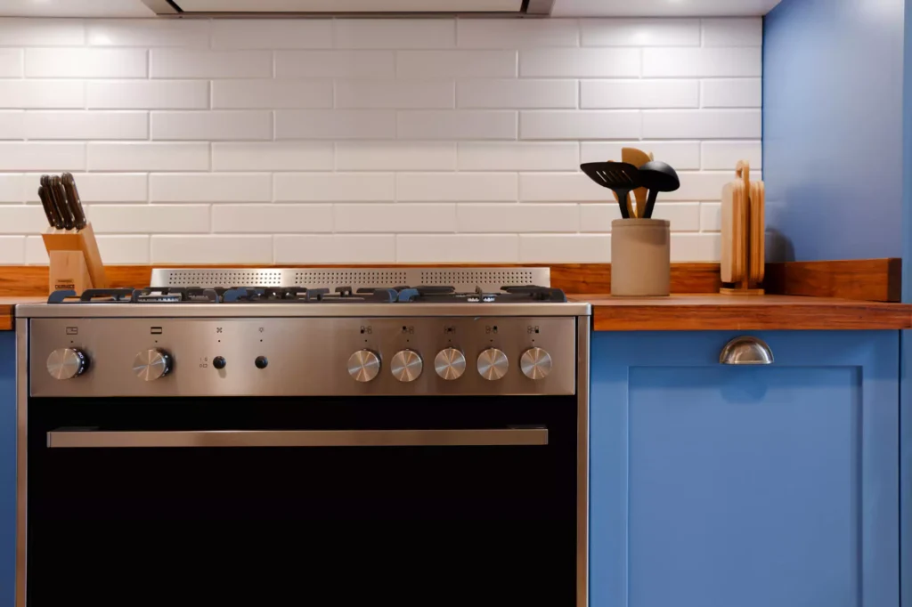 Traditional-style blue lacquered kitchen with wooden countertop, designed by Vitelier at Fontana Chica, Avándaro, State of Mexico.