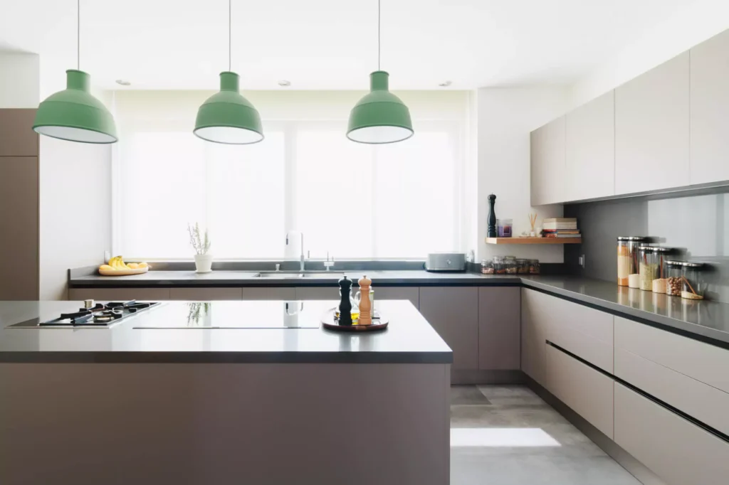 Modern L-shaped kitchen with central island designed by Vitelier at Torres Vallescondido, State of Mexico.