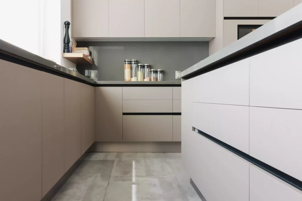 Modern L-shaped kitchen with central island designed by Vitelier at Torres Vallescondido, State of Mexico.