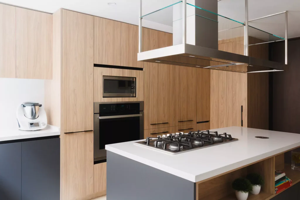 Wooden modular kitchen with central island designed by Vitelier in Coyoacán, Mexico City.