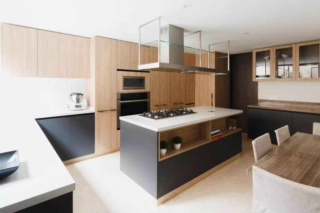 Wooden modular kitchen with central island designed by Vitelier in Coyoacán, Mexico City.