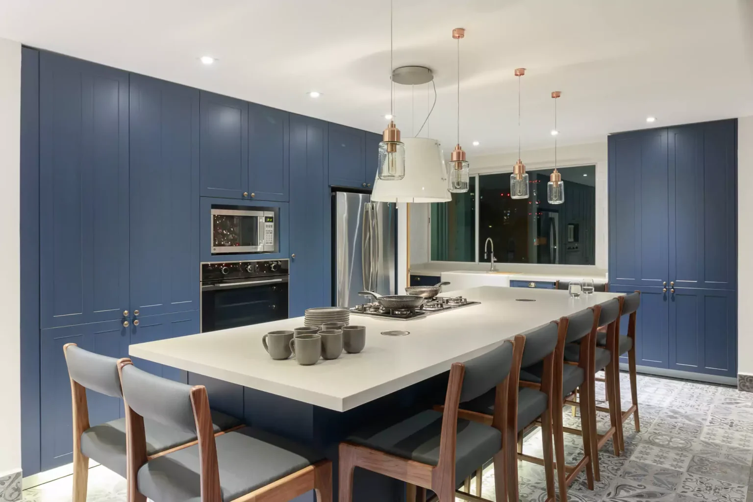 Classic-style navy blue lacquered kitchen designed by Vitelier at La Isla in Colonia Santa Fe, Mexico City.