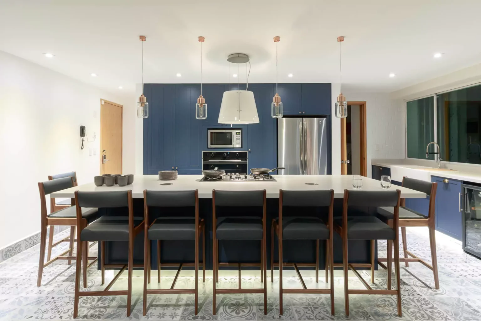 Classic-style navy blue lacquered kitchen designed by Vitelier at La Isla in Colonia Santa Fe, Mexico City.