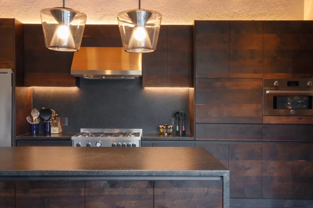 Industrial-style wooden kitchen with granite central island designed by Vitelier in Avándaro, State of Mexico