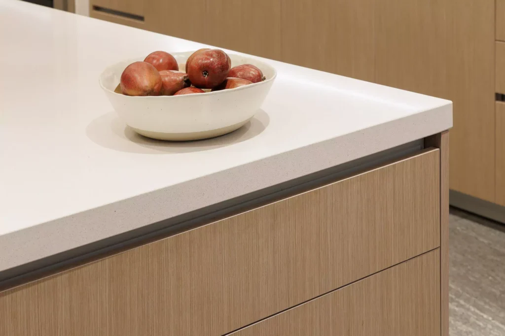 Modern kitchen with wood veneer and central island, designed by Vitelier at Granados, Colonia Bosques de las Lomas, Mexico City.