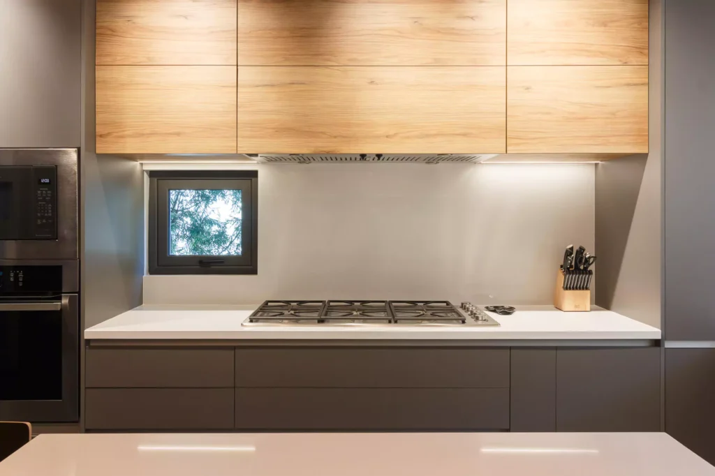 Modern L-shaped wooden kitchen designed by Vitelier at Las Villas, Colonia Lomas de Chapultepec, Mexico City.