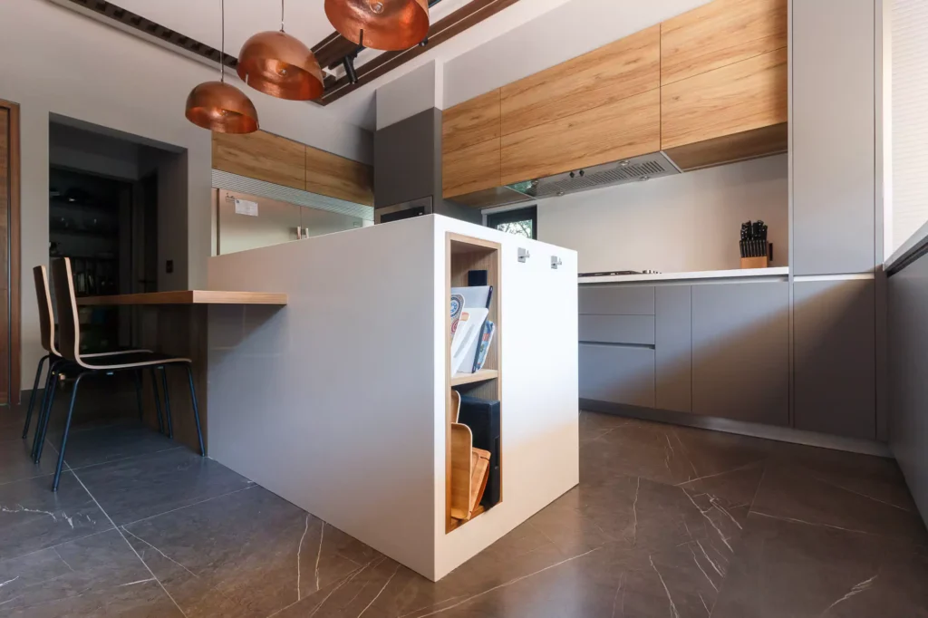 Modern L-shaped wooden kitchen designed by Vitelier at Las Villas, Colonia Lomas de Chapultepec, Mexico City.