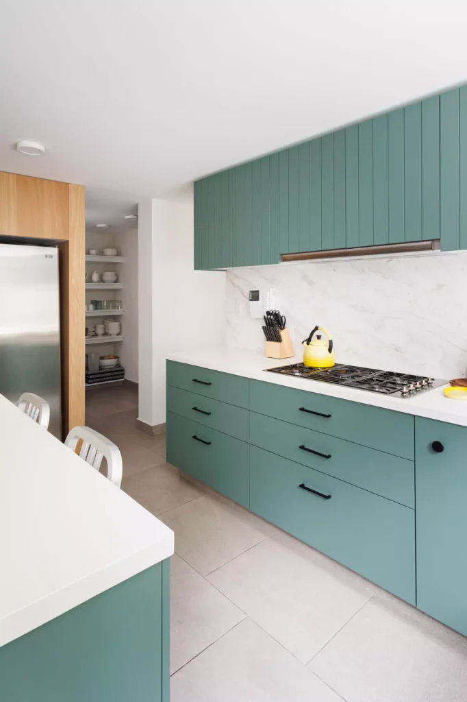 Sage green lacquered kitchen designed by Vitelier at Versalles in Lomas de Reforma, Mexico City.