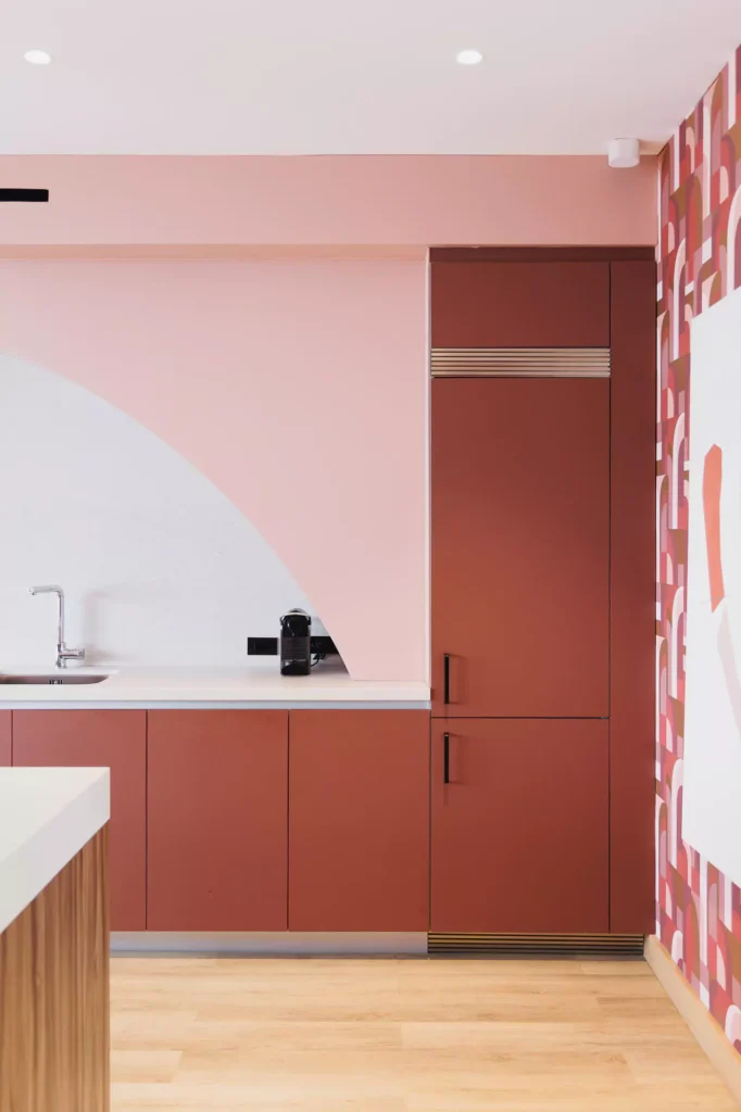 Custom terracotta kitchen with arch and central island, designed by Vitelier at Edificio Josefa in Colonia Juárez, Mexico City