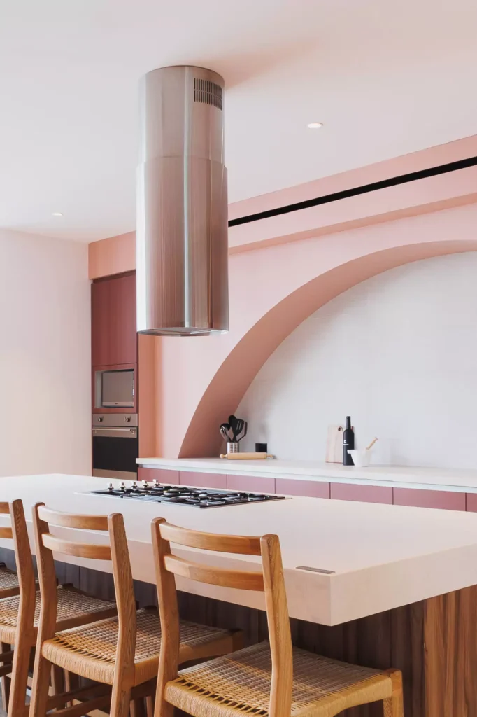 Custom terracotta kitchen with arch and central island, designed by Vitelier at Edificio Josefa in Colonia Juárez, Mexico City