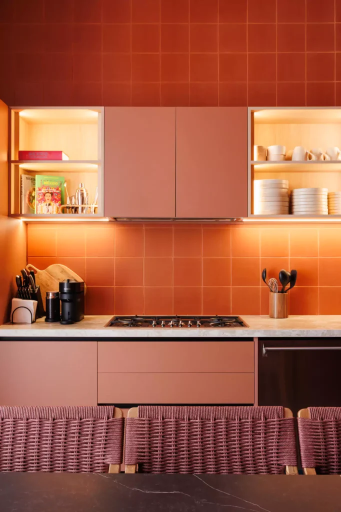 Custom red kitchen designed by Vitelier at Edificio Amalia in Colonia Nápoles, Mexico City.