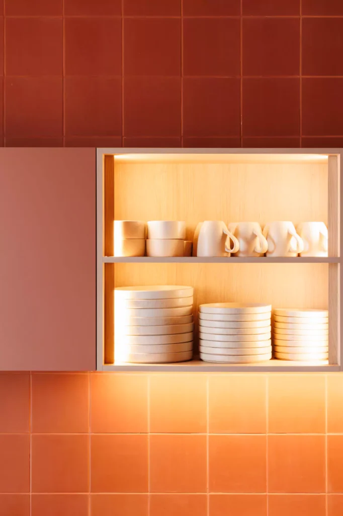 Custom red kitchen designed by Vitelier at Edificio Amalia in Colonia Nápoles, Mexico City.