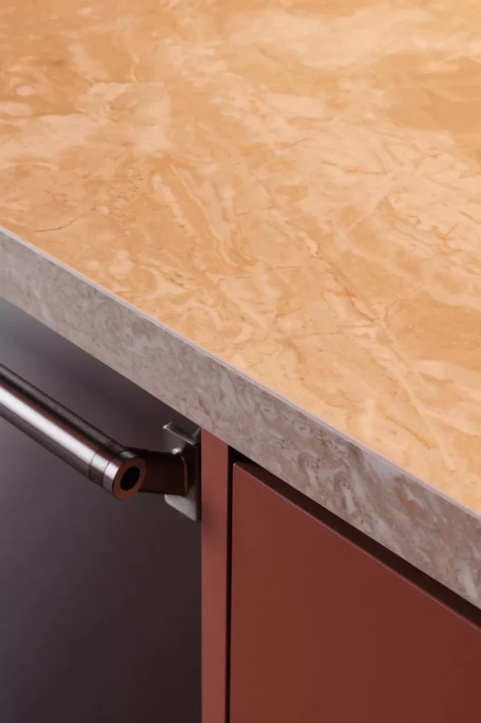 Custom red kitchen designed by Vitelier at Edificio Amalia in Colonia Nápoles, Mexico City.