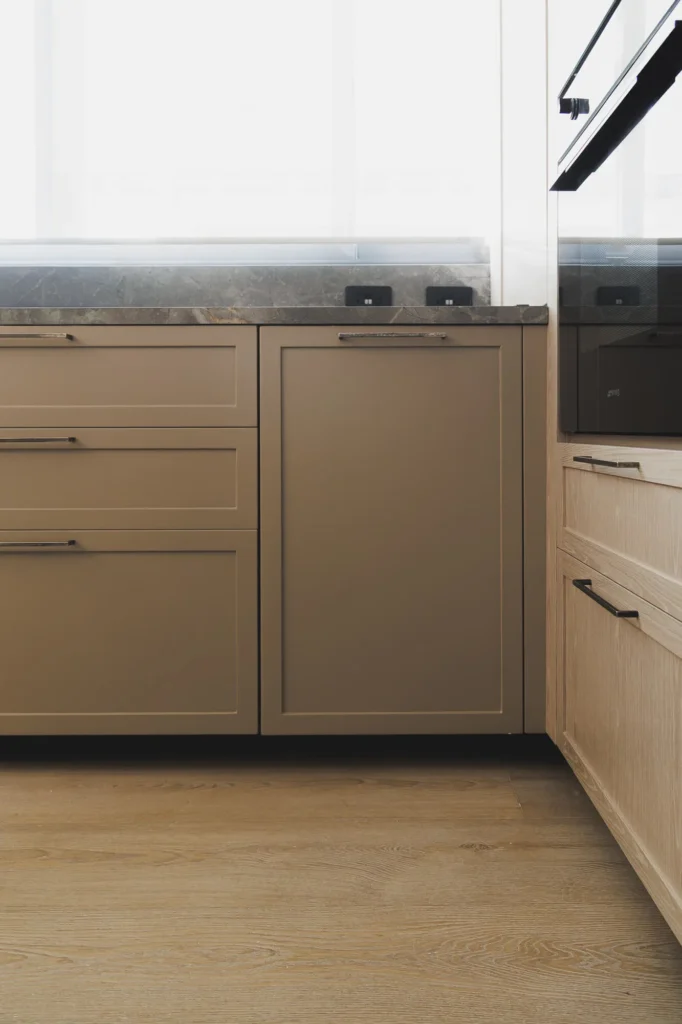Interior storage detail in patina wood kitchen with sintered stone countertop in Coyoacán, designed by Vitelier.