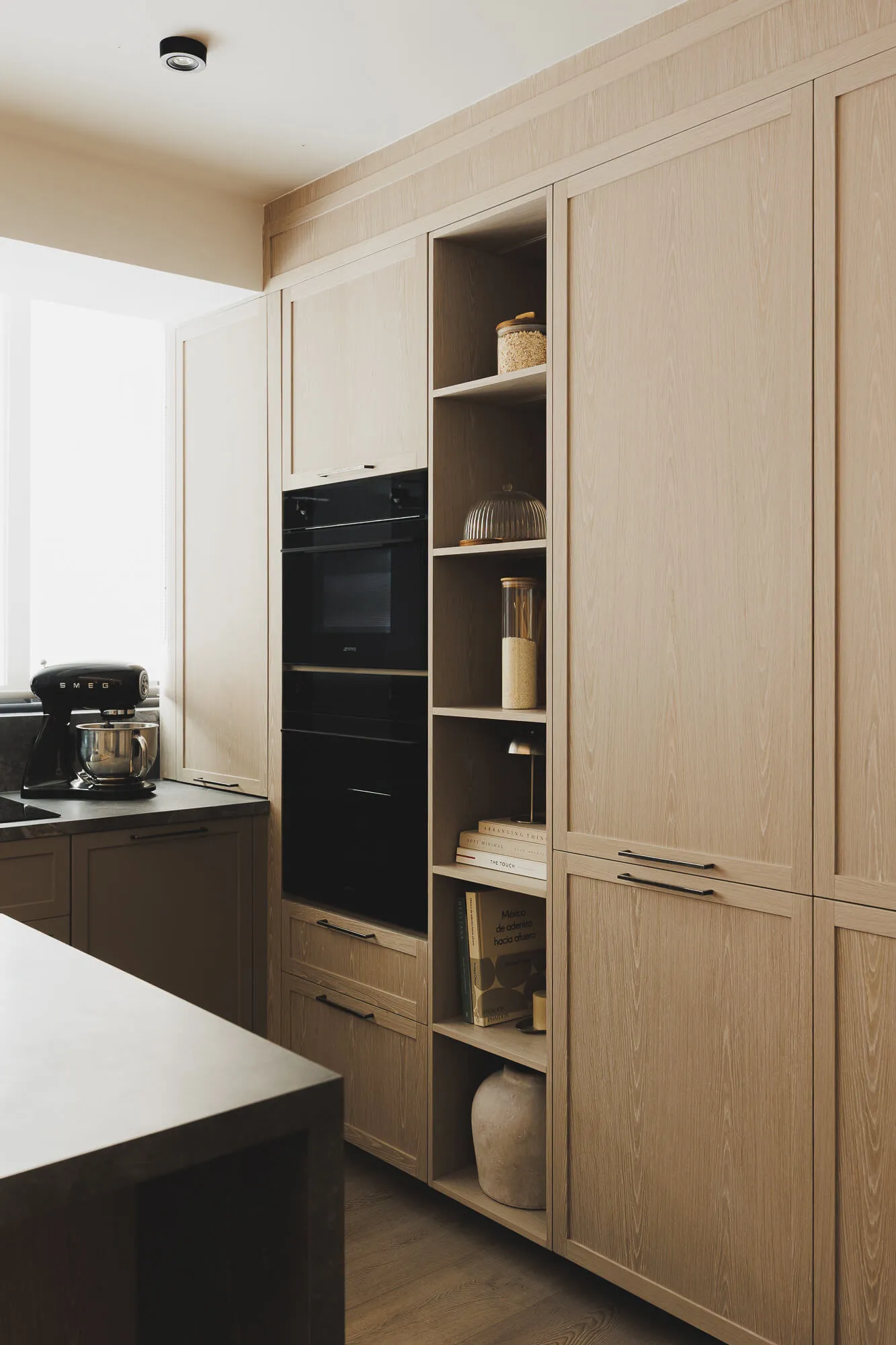 Wood kitchen with patina finish and sintered stone countertop designed by Vitelier in Mexico City