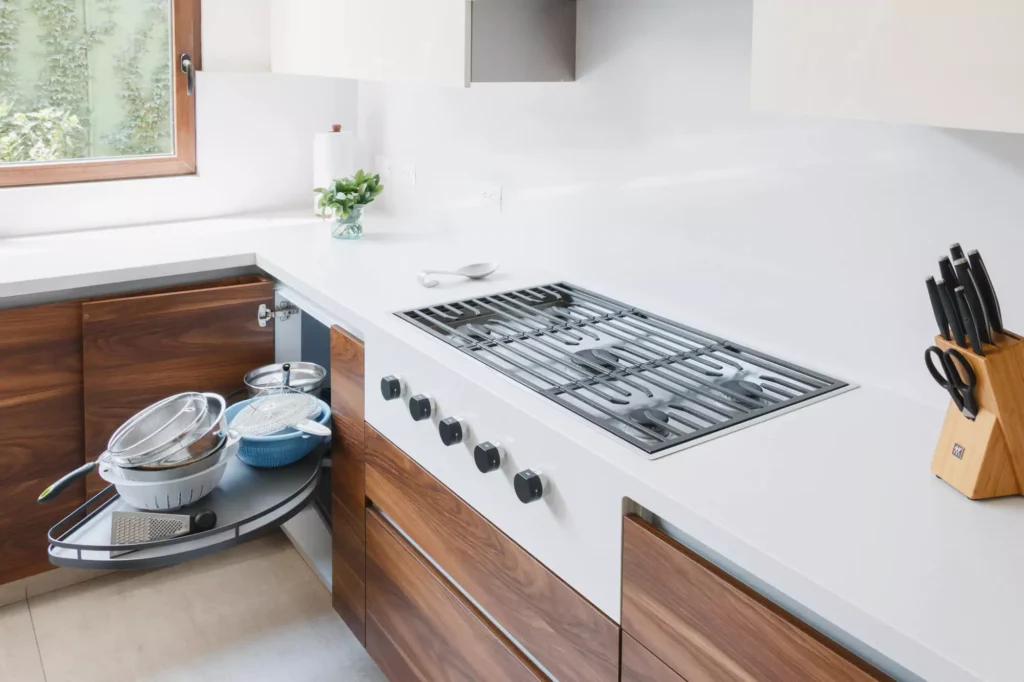 Articulated corner mechanism demonstrating premium Blum hardware integration in a Vitelier kitchen