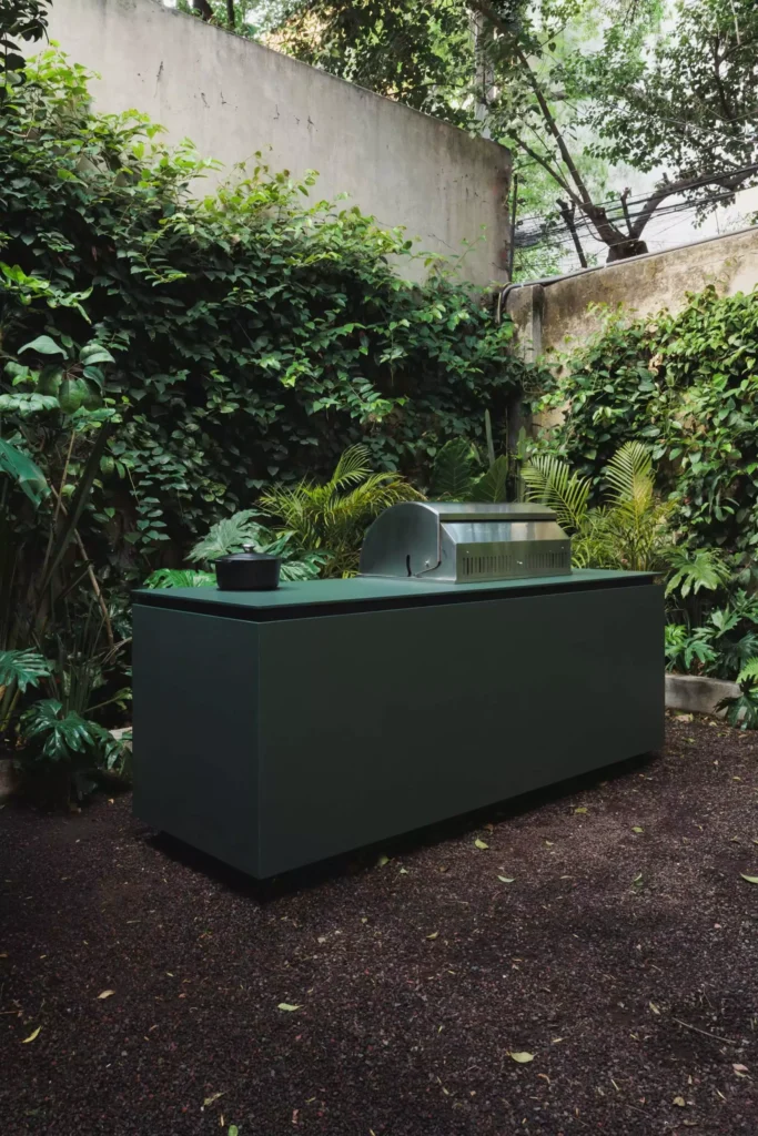 Outdoor kitchen with Blaze grill and invisible induction cooktop designed by Vitelier